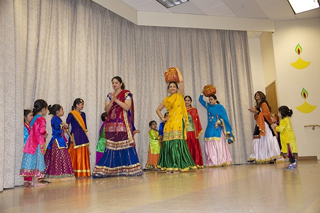 Women perform a dance at Saturday's Diwali festival at MI Presbyterian Church.