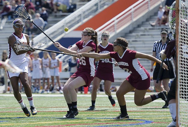 Lakeside’s Kaylee Best (No. 7) scores as Lakeside downs Mercer Island 12 – 5 to finish third in state at the Washington Lacrosse Girls State Championship tournament Saturday at the Eastside Catholic School in Sammamish.