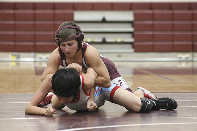 Mercer Island’s Jordan Tillinger locks with Chief Sealth’s Richard Pham Thursday