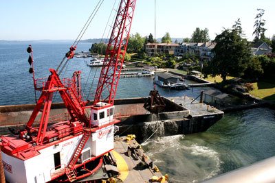 Mason Construction begins work on the Sewer Lake Line Project off the North end of Mercer Island near the I-90 bridge.