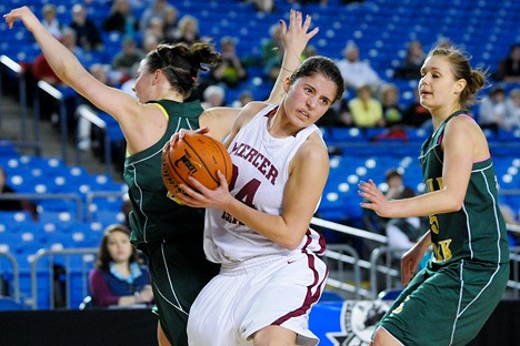 Islanders Sarah Taylor (24) is fouled while grabbing a rebound against Shadle Park at the Tacoma Dome on Saturday.