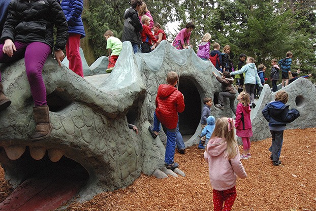 A new generation of kids play on artist Kenton Pie's dragon.