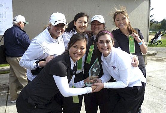 The MIHS girls golf team celebrates after winning the SeaKing District title on Monday. The team now travels to state on May 24 at Liberty Lake in Spokane.