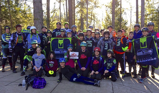 The Mercer Island mountain bike team shows off its Seahawks pride after a ride last weekend. The Hawks play Carolina at 10 a.m. on Sunday after an improbable wild-card win against Minnesota on Jan. 10.