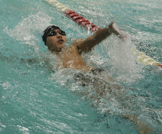 Mercer Island’s Christopher Shin swims the 100 yard backstroke Thursday