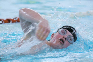 Islander Ben Neary during a recent practice at Mary Wayte Pool. The sophomore does not let disabilities keep him out of the pool.