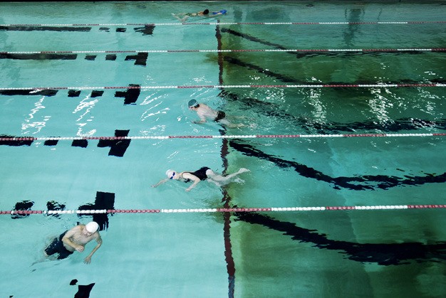 Swimmers at Mary Wayte Pool enjoy the open swim time. City officials and the school district are working on a plan to keep the pool open.