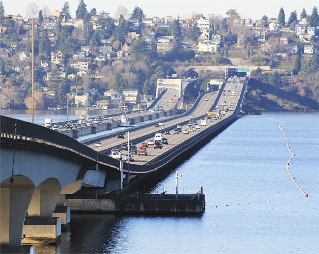 Cars and trucks stream across the Interstate 90 floating bridge on Thursday