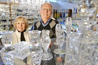 Chad Coleman/Mercer Island Reporter Kris and Chuck Kusak are pictured in the showroom at Kusak Cut Glass Works in the Rainier Valley last week.