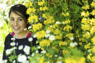 Chad Coleman/Mercer Island Reporter Island resident Sara Seumae models organic SPUN clothing in her home garden on Mercer Island.