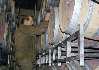 Dee Hitch/Special to the Reporter Employee Chris Howell works in the barrel room at the Cain Vineyard and Winery in the Mayacamas Mountains in California.