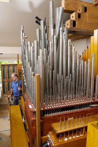 Chad Coleman/Mercer Island Reporter Islander Carl Dodrill stands among parts of a pipe organ being built for a church in New Orleans