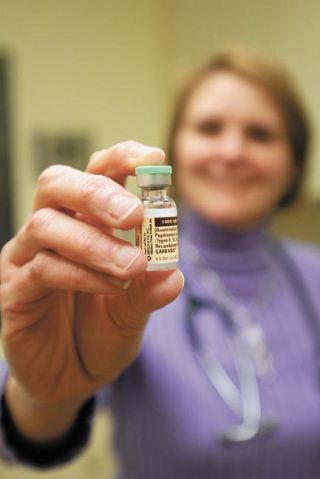 Chad Coleman/Mercer Island Reporter Dr. Danette Glassy holds a vial of the HPV vaccine Gardasil administered to girls and women aged 12-26