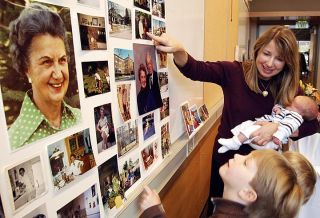 Elizabeth Celms/Mercer Island Reporter Kirsten Sands (above) shows her two sons photographs of their great-grandmother