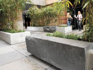 Chad Coleman/Mercer Island Reporter The “Zen garden” complete with stone benches near the entrance to Emerald City Smoothies in Island Market Square.