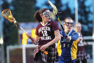 Chad Coleman/Mercer Island Reporter Islander Monique Schreiber looks for a shooting lane against Bellevue April 25. The Islanders out-shot Bellevue 40-3.