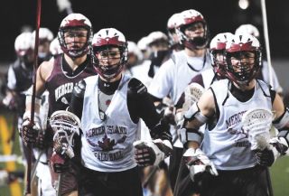 Chad Coleman/Mercer Island Reporter The three-time defending state champion Mercer Island boys lacrosse team warms up before practice Wednesday.