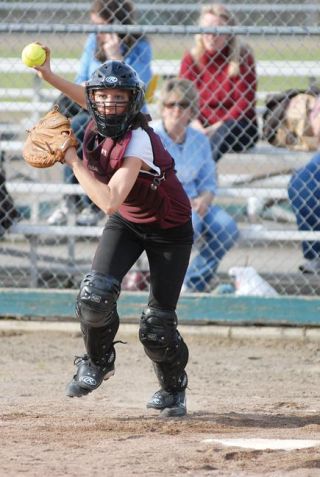 Photos by Chad Coleman/Mercer Island Reporter Catcher Alysa Moore looks a baserunner back to third during her first season at the position of catcher.