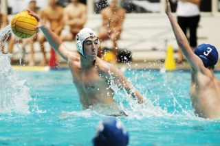 Chad Coleman/Mercer Island Reporter Islander Kennan Adams takes a shot-on-goal against Newport during the state championship game at the King County Aquatic Center in Federal Way