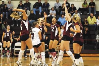 Chad Coleman/Mercer Island Reporter The Mercer Island girls volleyball team celebrates an ace Friday against Mount Si in the high school gymnasium. The Islanders will face Skyline tonight in battle of the unbeaten KingCo teams.