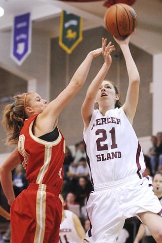 Chad Coleman/Mercer Island Reporter Islander Katherine DaPron drives hard to the basket against Newport