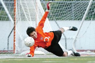 Chad Coleman/Mercer Island Reporter Islander sophomore goalkeeper Forrest Marowitz blocks the final overtime shootout attempt by Bellevue to seal the Mercer Island victory.
