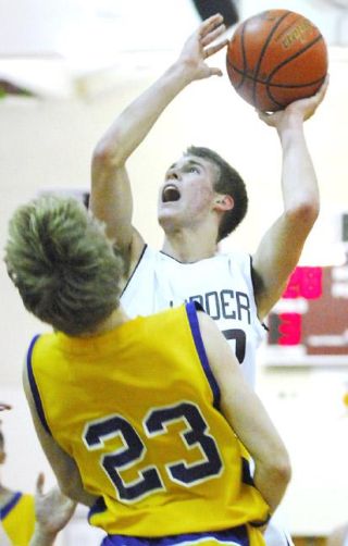 Chad Coleman/Mercer Island Reporter Islander Matt Schut makes a strong drive to the basket versus Issaquah Friday during the team’s 61-55 loss. The team will next play at 7:30 p.m.