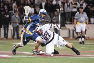 Chad Coleman/Mercer Island Reporter Islander JP Bruckner battles a Bainbridge Island player for posession of the ball.