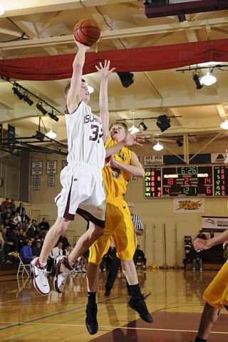 Chad Coleman/Mercer Island Reporter Islander Matt Schut drives to the basket for two of his 17 points against Issaquah. His biggest shot came with 1.2 seconds remaining