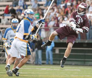 Chad Coleman/Mercer Island Reporter Mercer Island senior Greg Mahony elevates and fires a shot-on-goal during the boys lacrosse championship game against Bainbridge Island at Memorial Stadium on Saturday. For the first time in three years