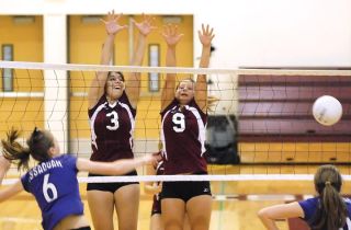 Chad Coleman/Mercer Island Reporter Mercer Island volleyball players Shayda Sanii (3) and Ally Bray (9) block an Issaquah kill attempt en route to a 3-0 sweep at Mercer Island on Friday.