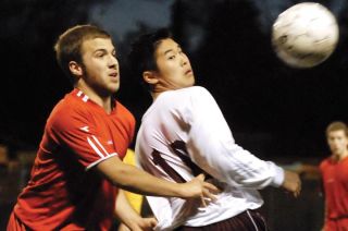 Chad Coleman/Mercer Island Reporter Islander Leandro Kimura battles a Mount Si player for possession of the ball during the Islanders’ 2-1 victory.
