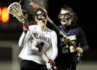 Chad Coleman/Mercer Island Reporter Islander Hannah Bahn drives against a Bainbridge defender at Islander Stadium