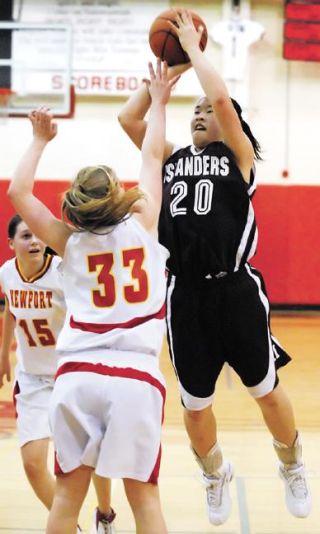 Chad Coleman/Mercer Island Reporter Islander sophomore Janelle Chow scores two of her team high 17 against Newport on Feb. 14. Mercer Island overcame a 16-point deficit to beat the Knights for the first time this season and qualify for districts.