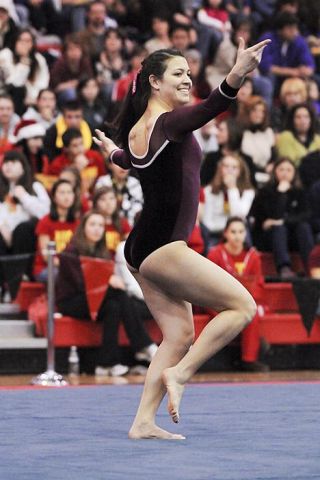 Chad Coleman/Mercer Island Reporter Mercer Island senior Laura Maruhashi competes at districts during the floor exercise.