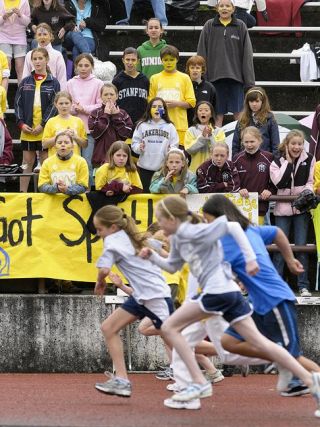 Chad Coleman/Mercer Island Reporter Rain and wind couldn’t dampen the spirits of the Lakeridge Lions during the 38th annual All-Island Track meet.