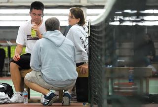 Chad Coleman/Mercer Island Reporter Mercer Island head tennis coach Joyce Hedlund councils a student athlete during a state tournament match.