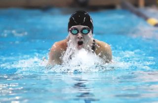 Chad Coleman/Mercer Island Reporter Islander Lauren Poli competes in the 200-yard freestyle during the district meet at Hec Ed pool at the UW.