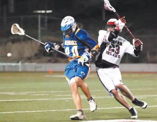 Chad Coleman/Mercer Island Reporter Islander A.J. Ellis goes after a loose ball against Bainbridge earlier this season. Ellis is becoming a big offensive threat for Mercer Island.