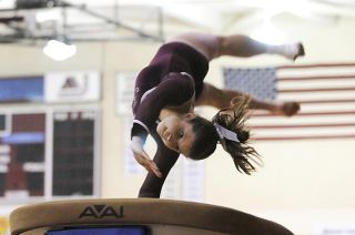 Chad Coleman/Mercer Island Reporter Islander Erika Reutimann leaps toward the vault against Newport