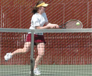Chad Coleman/Mercer Island Reporter Islander Michelle Zemplenyi returns a serve during the districts meet held at Lower Woodland Park May 15.