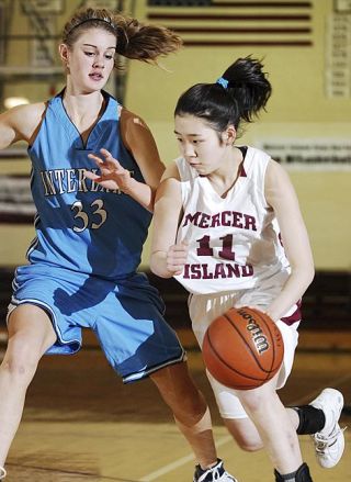 Chad Coleman/Mercer Island Reporter The Mercer Island girls basketball team survived a scare on Wednesday as Saint player Sarah Anderegg