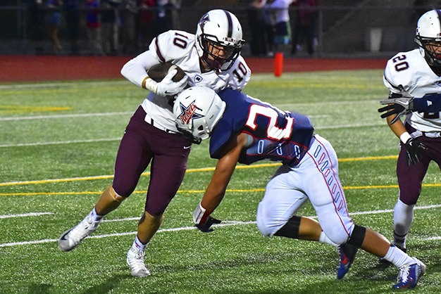Mercer Island wide receiver Griffin Kane runs out of room against the Juanita defense Friday