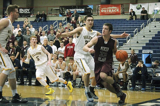Mercer Island’s David Emanuels (33) looks for an opening in the Wolverine defense Thursday