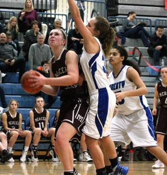 Mercer Island's Anna Luce goes up for a shot against Liberty's Samantha Kelderman Friday