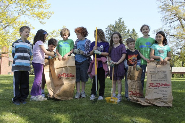 Lakeridge Elementary third-graders help with clean-up at the Luther Burbank Park shoreline on Friday afternoon