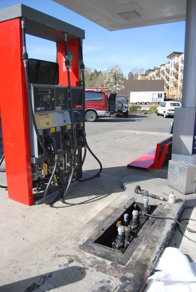 A new pump tank awaits installation at the Town Center Chevron station on March 19 after the original tank was charred in an explosion.