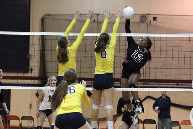 Mercer Island's Jemma Yeadon goes up for a spike against Bellevue during the 3A KingCo Tournament championship Saturday at Juanita High School.
