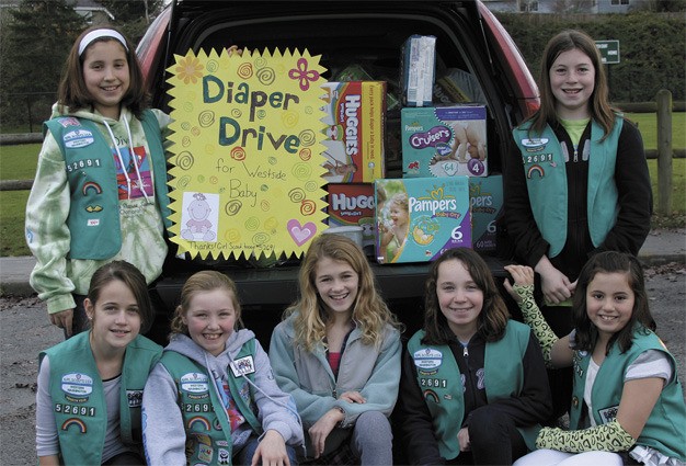 Members of the Mercer Island Girl Scout Troop 52691 collected over 3