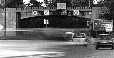 Interstate 90 had electronic signs set above each lane to allow for opening or closing the lanes according to traffic flows at peak periods. The signs were abandoned when the bridge was rebuilt and express lanes were added.